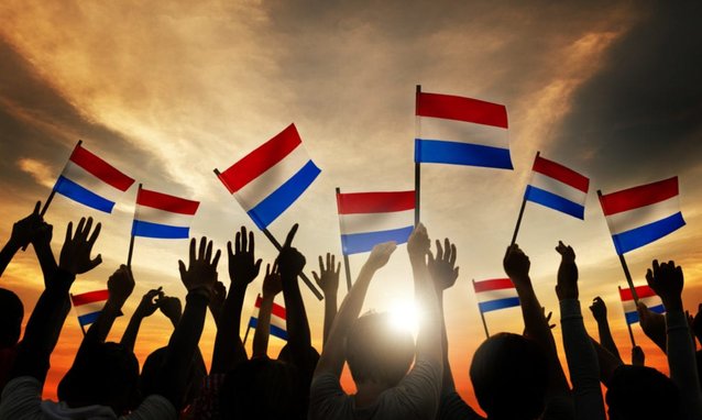 Silhouettes,Of,People,Holding,Flag,Of,Netherlands