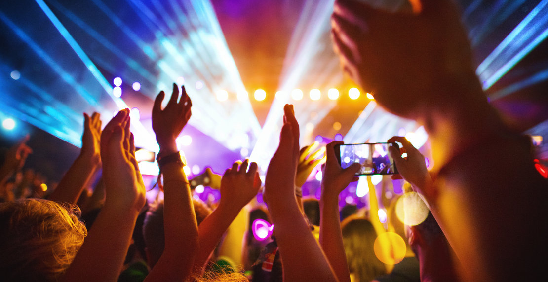 Cheering crowd at a concert.