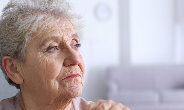 Elderly,Woman,With,Walking,Stick,At,Home