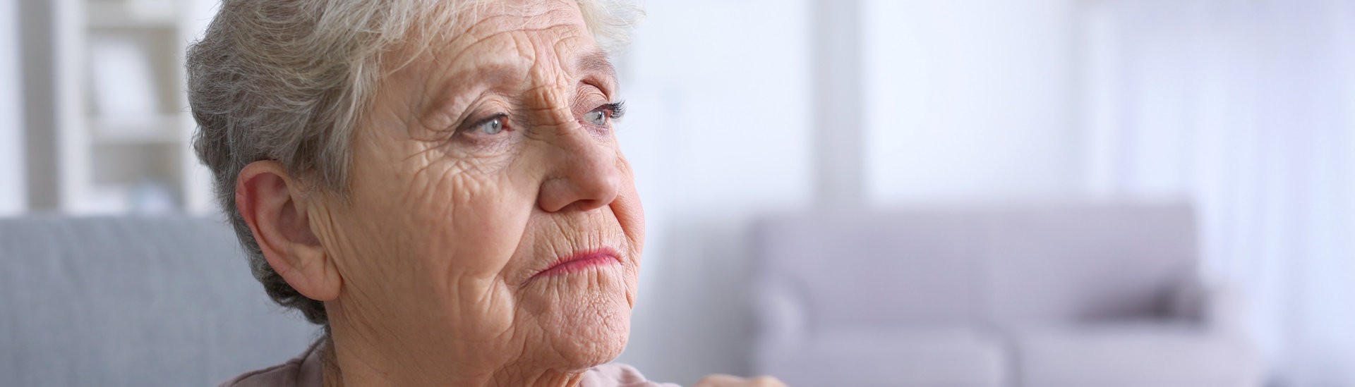 Elderly,Woman,With,Walking,Stick,At,Home