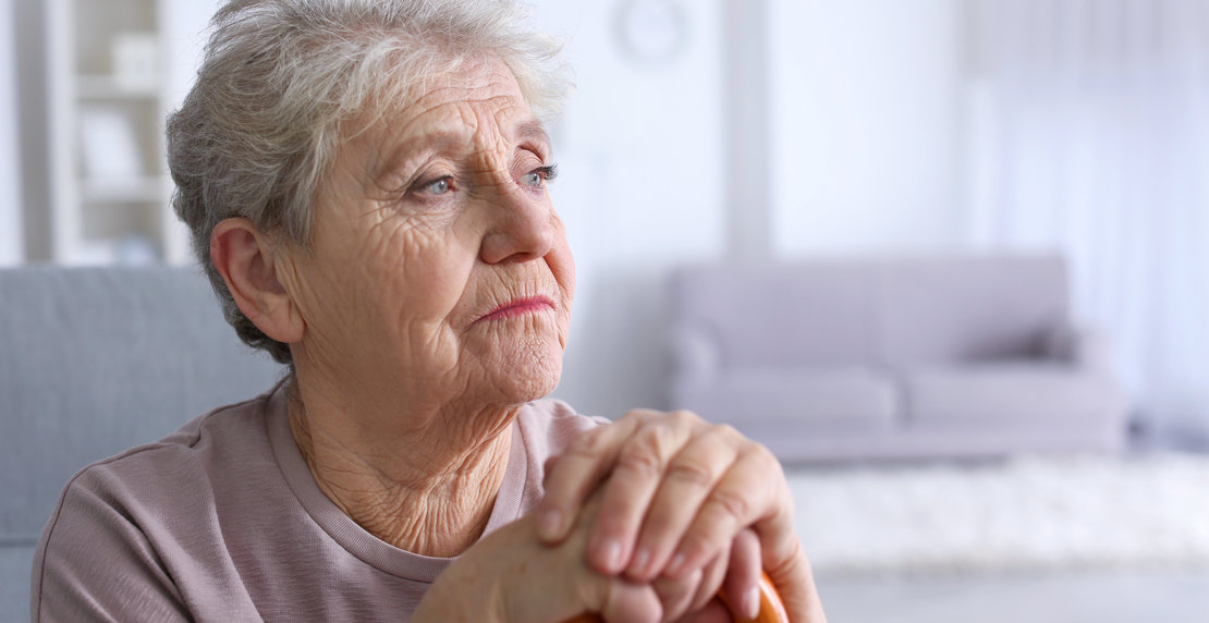 Elderly,Woman,With,Walking,Stick,At,Home