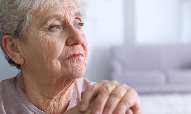 Elderly,Woman,With,Walking,Stick,At,Home