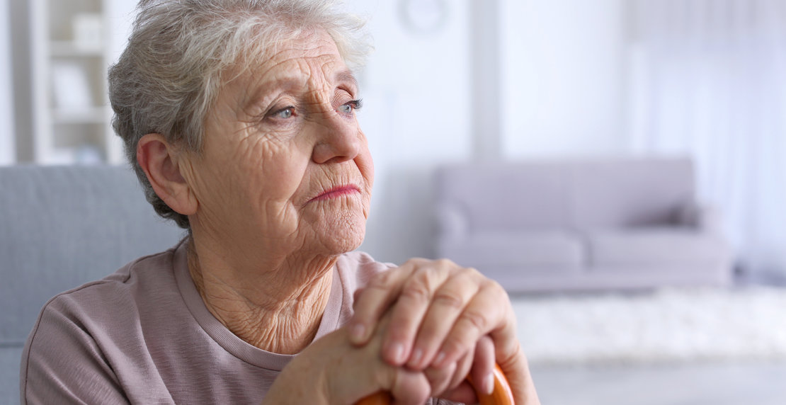 Elderly,Woman,With,Walking,Stick,At,Home